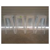Four white metal bar stools, 30 in