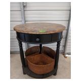 Round corner table with three wicker baskets, and