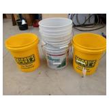 Two empty 5 gallon McCoy buckets, and three