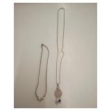 2 sterling silver necklaces with pendants