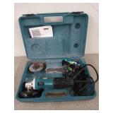 Makita 4-in angle grinder in case, with