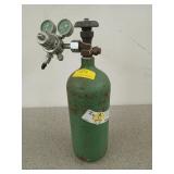 Empty green oxygen cylinder with gauges, 18 in