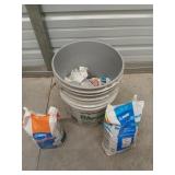 Two 4.5 gallon buckets with assorted