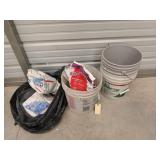 Three 4.5 gallon buckets with leveling compound,