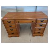 Seven drawer wooden desk, has some scuffs,