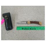 Buck pocket knife with black leather case, 3.5 in