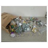 Box filled with Mardi Gras beads and other