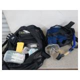 Two bags filled with scuba diving equipment,