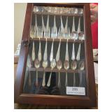 24 silver plate utensil collection in wall cabinet