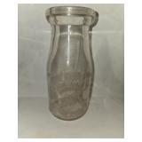 Class pint Guernsey dairy cream bottle .