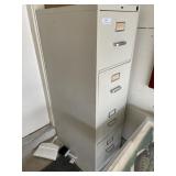 Metal four drawer file cabinet .