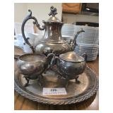 Four pieces of silver plate .