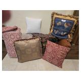 Several assorted accent pillows