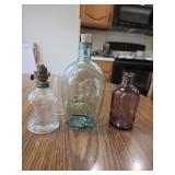 Miniature kerosene lamp and two colored bottles