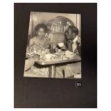 Couple Dressed in Formalwear in Cafe Photograph