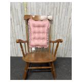 Vintage rocking chair with pink cushion