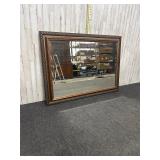 large rectangular wall mirror featuring a gilt, ri