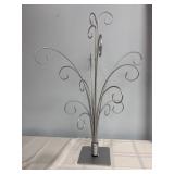 silver-colored metal ornament display tree