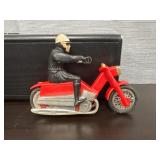 vintage red motorcycle toy with rider