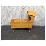 vintage or antique style wooden rocking cradle