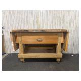 Wooden work bench on casters