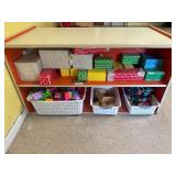 Double sided kids shelf with contents