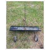 pull-behind lawn dethatcher