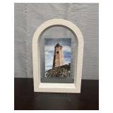 Lighthouse photo in stone frame