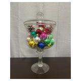 Large covered glass dish with Christmas ornaments