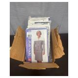 Box of various vintage sewing patterns