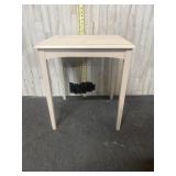 Light colored wooden side table