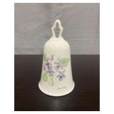 Vintage white porcelain bell featuring violet flor