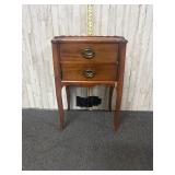 vintage two-drawer nightstand in a Federal style