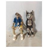Shelf sitting figurines