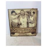 'Knuckleheads Fix It Shop' tin sign