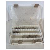 Tackle box of assorted fishing hooks