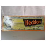 vintage-style tin sign features retro artwork for
