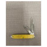 vintage yellow celluloid-handled pocket knife