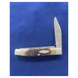Case XX folding pocket knife featuring a jigged bo