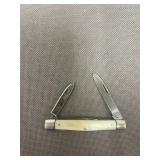 vintage Imperial pocket knife features a white, im