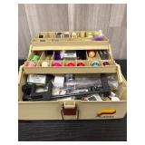 Tackle box of fly fishing lure supplies