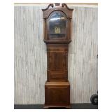 Antique wooden grandfather clock with face