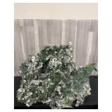 Huge lot of snow-covered evergreen branch garlands