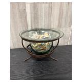 Decorative glass bowl with wrought iron holder