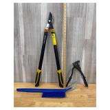 Ice scraper and lopping shears and a rivet gun