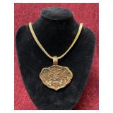 gold-toned necklace with pendant