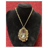 gold-tone necklace with a large teardrop crystal p