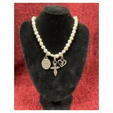 Faux pearl necklace with silver charms