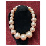 Faux pink pearl necklace
