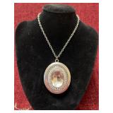 Silver colored necklace with pendant